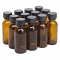 NMS 1 Ounce Glass Amber Boston Round Bottles - With 22mm Black Poly Lids - Case of 12